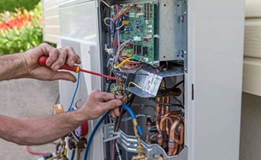 plumber at work installing a circulation pump